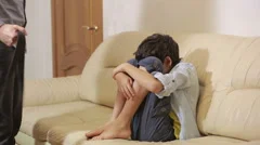 strict-father-punishing-his-son-footage-068971370_iconm